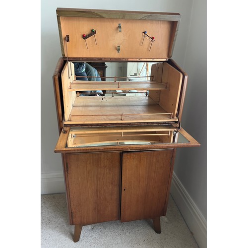 75 - An Art Deco cocktail cabinet with mirrored interior. 114cm h x 64cm w x 40cm d.