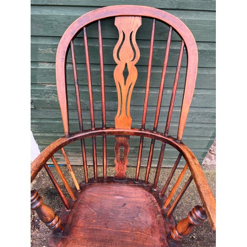 78 - A 19thC ash and elm high back windsor chair. 109cm h to back.