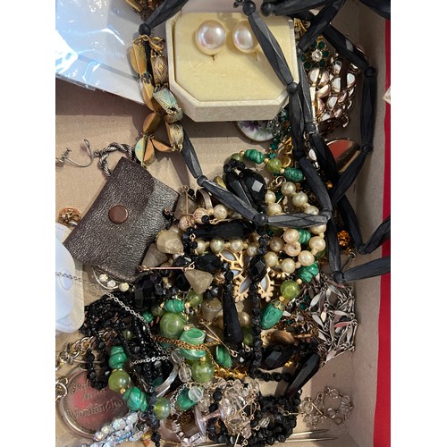 355 - A large quantity of vintage costume jewellery and boxes to include brooches, beads etc.