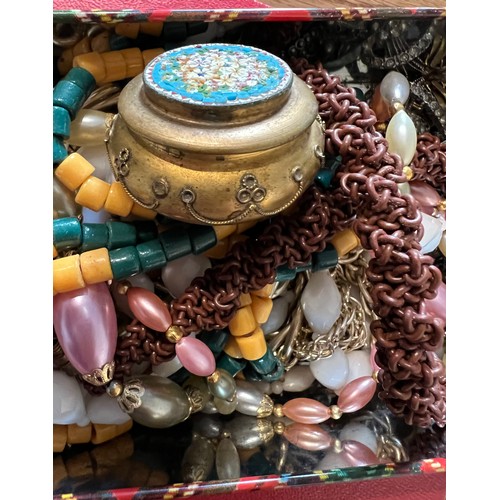 355 - A large quantity of vintage costume jewellery and boxes to include brooches, beads etc.