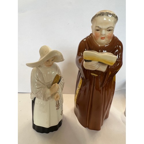 166 - Royal Worcester candle snuffers, a monk and a nun.