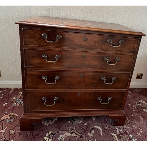 80 - A 19thC mahogany chest of four graduated drawers on bracket feet, with original brass swan necked ha... 