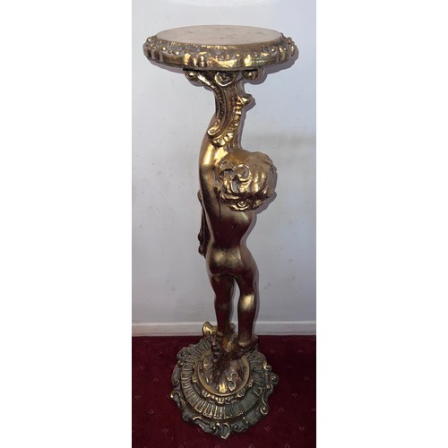 87 - A gilt torchère formed as a standing cherub. 102cm h.