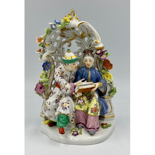 255 - A Meissen porcelain 20thC chinoiserie figure group of a Chinese couple sitting in a floral arbour wi... 