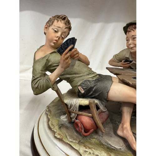 144 - Capodimonte - The Cheaters - A large 20thC Italian Capodimonte porcelain group figure entitled 'The ... 