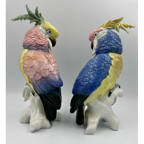 151 - Two Karl Ens porcelain Cockatoos, each modelled perched on a branch and glazed in pastel colours, ma... 