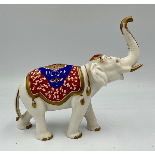 155 - A Rudolf Kammer Volkstedt 20thC porcelain model of an elephant, 14cm h with printed marks to undersi... 