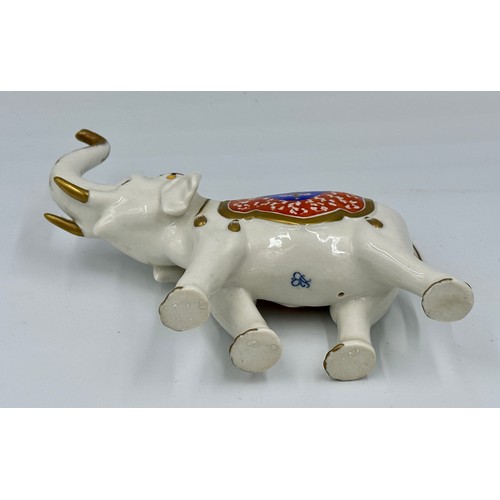 155 - A Rudolf Kammer Volkstedt 20thC porcelain model of an elephant, 14cm h with printed marks to undersi... 