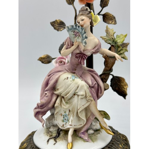 159 - A pair of Capodimonte and gilt metal figure table lamps modelled as an 18th century courting couple.... 