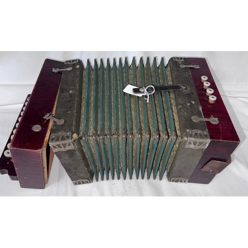 1251 - A Vintage accordion. 28cm x 25cm.