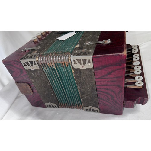 1251 - A Vintage accordion. 28cm x 25cm.