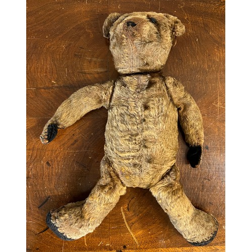 1098 - An early 20thC mohair teddy bear with black button eyes together with knitted trousers, jacket and h... 