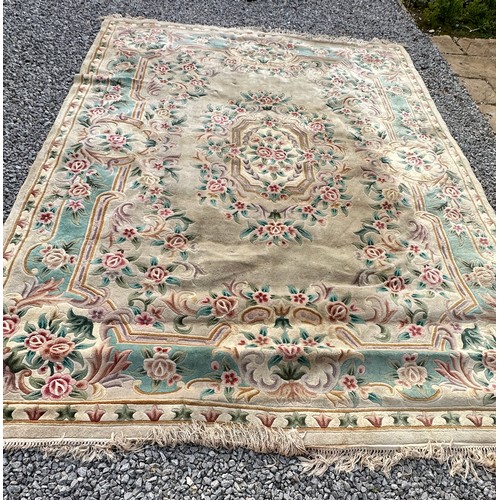 1238 - A large oriental wool carpet. 356 x 270cm.