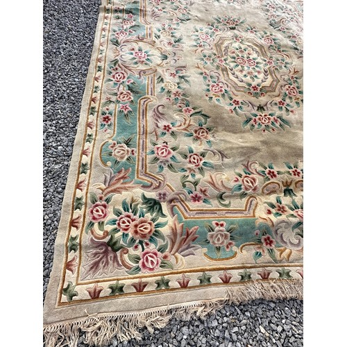 1238 - A large oriental wool carpet. 356 x 270cm.