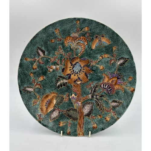 1160 - A large oriental painted display plate. 32cm d.