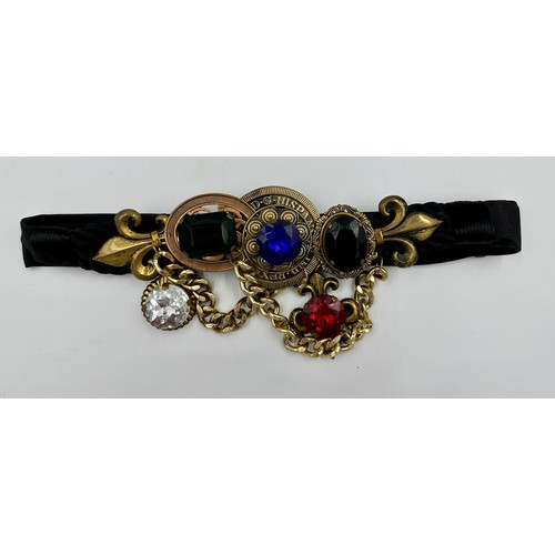 935 - A vintage early 1980's adjustable belt with faux jewels and gold coloured chains by Carolyn Tanner D... 