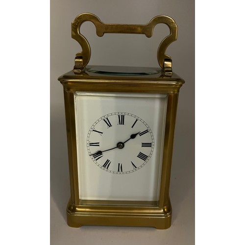 1271 - Brass carriage clock made in France for the English market with white enamel dial and visible escape... 