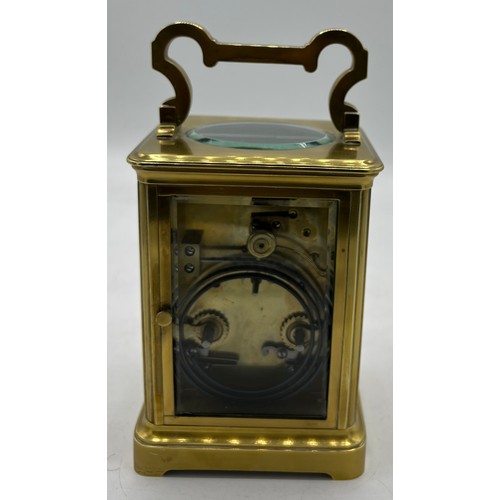 1271 - Brass carriage clock made in France for the English market with white enamel dial and visible escape... 