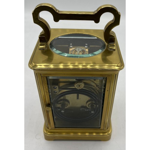 1271 - Brass carriage clock made in France for the English market with white enamel dial and visible escape... 