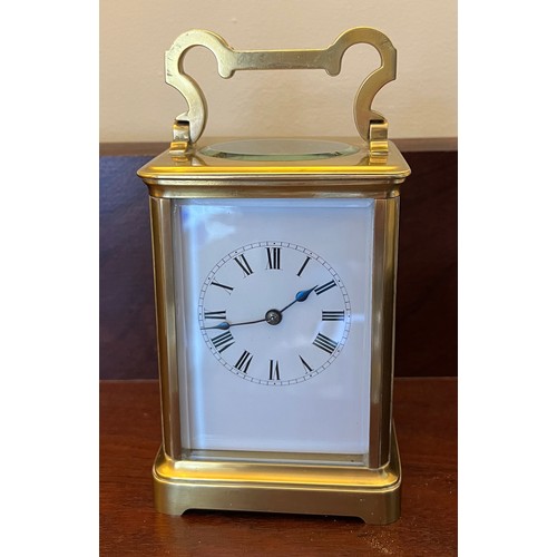 1271 - Brass carriage clock made in France for the English market with white enamel dial and visible escape... 