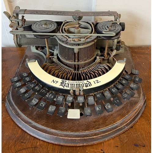 1298 - An American Hammond no. 12 typewriter on oak base. Approximately 38cm w.