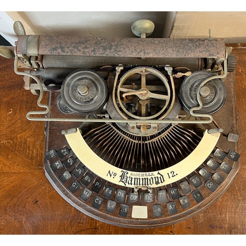 1298 - An American Hammond no. 12 typewriter on oak base. Approximately 38cm w.