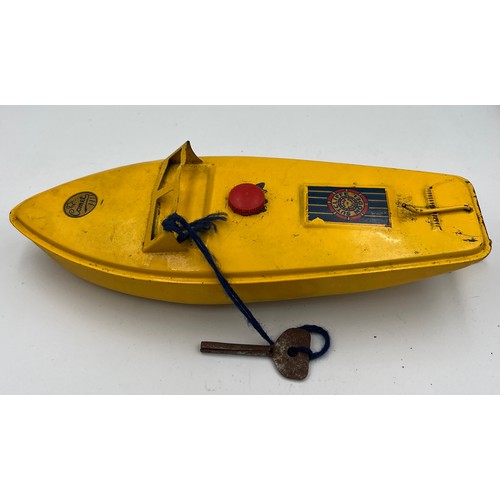 1104 - A vintage Comet Sutcliffe model clockwork speedboat in original box. Speedboat 24cm l.