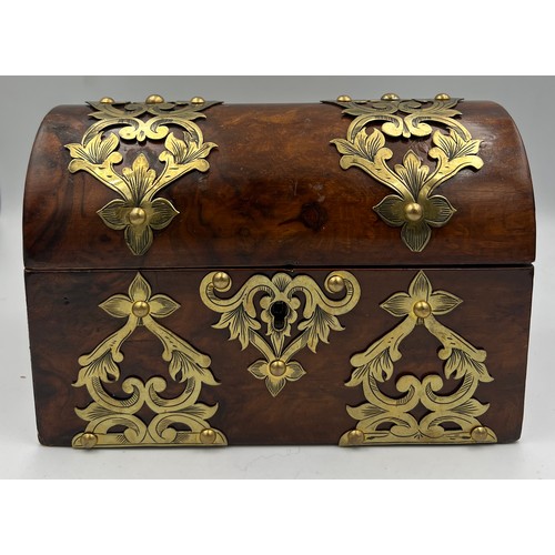 1174 - Victorian burr walnut brass bound domed topped casket containing two glass scent bottles and stopper... 