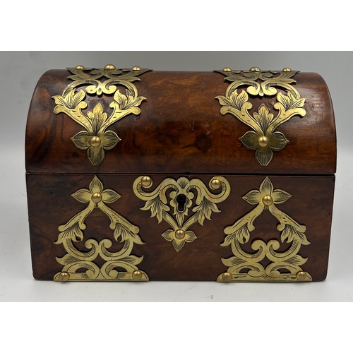 1174 - Victorian burr walnut brass bound domed topped casket containing two glass scent bottles and stopper... 