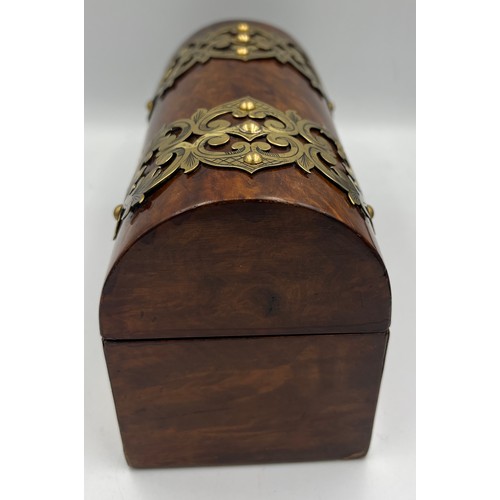 1174 - Victorian burr walnut brass bound domed topped casket containing two glass scent bottles and stopper... 