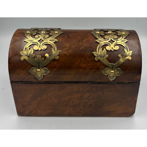 1174 - Victorian burr walnut brass bound domed topped casket containing two glass scent bottles and stopper... 