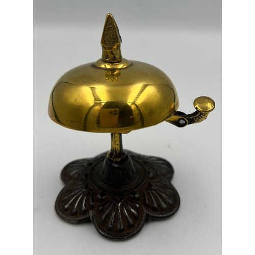 1178 - A late 19th/early 20thC brass and iron reception bell in good working order. 10cm h.