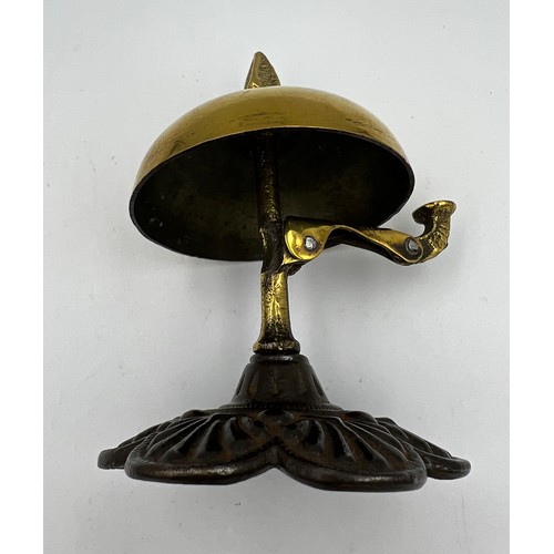 1178 - A late 19th/early 20thC brass and iron reception bell in good working order. 10cm h.