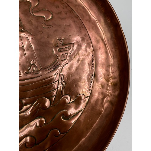 1179 - Keswick school copper wall plate by W.H Mawson embossed with a Viking ship, 20.5cm d,