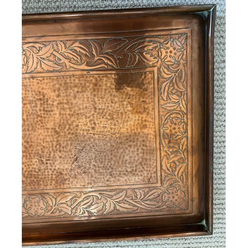 1181 - Copper tray by Keswick School of Industrial Art, a hammered centre with foliate border. Marked to re... 