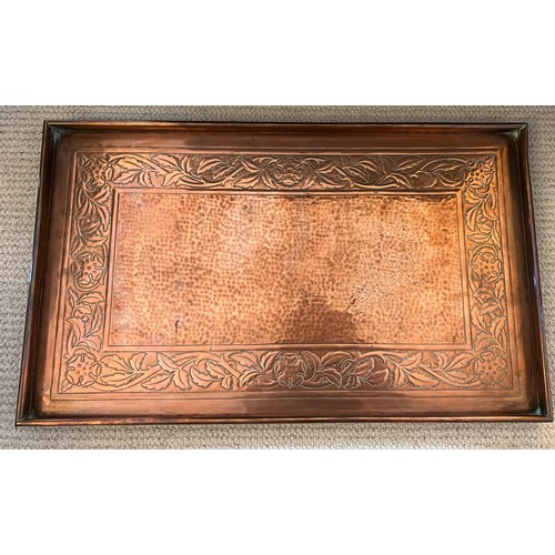 1181 - Copper tray by Keswick School of Industrial Art, a hammered centre with foliate border. Marked to re... 