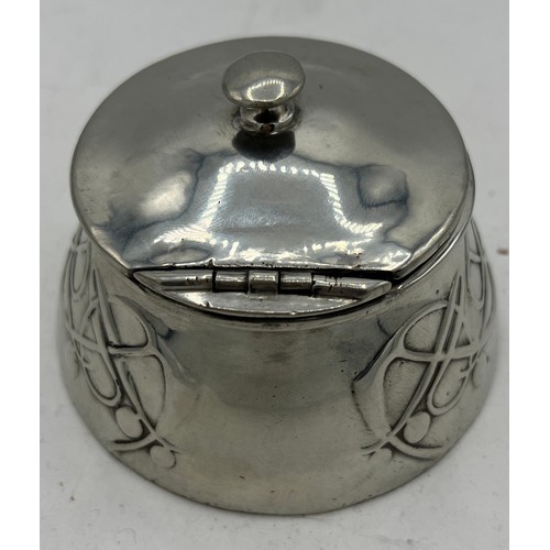 1185 - Archibald Knox Tudric polished pewter inkwell. 10cm x 10cm.