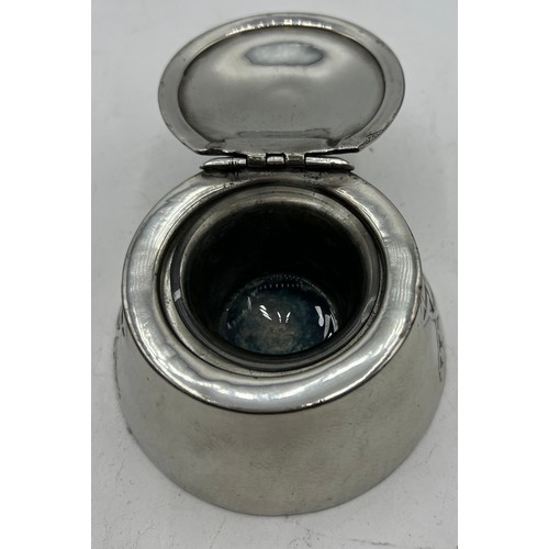 1185 - Archibald Knox Tudric polished pewter inkwell. 10cm x 10cm.