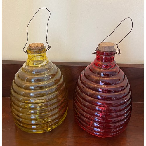 328 - Two early 20thC coloured glass wasp traps. 21cm h.