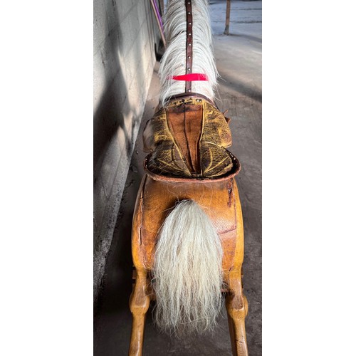 1101 - Large vintage wooden rocking horse with horse hair mane and tail, leather bridle and saddle. 121cm h... 