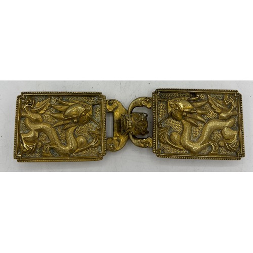 1289 - A Chinese gilt bronze dragon two part belt buckle, probably 19thC. 14cm x 4cm.