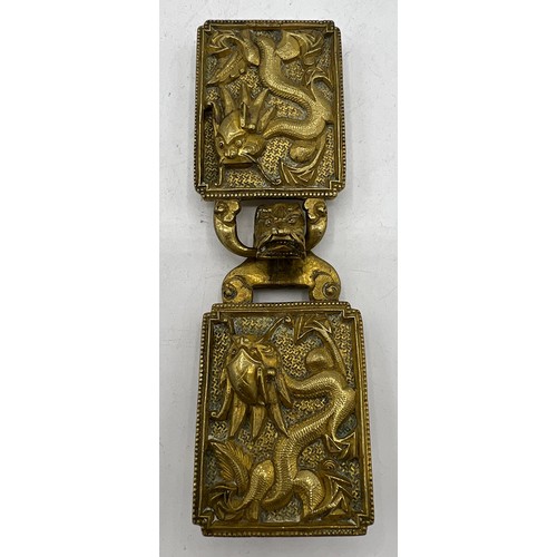 1289 - A Chinese gilt bronze dragon two part belt buckle, probably 19thC. 14cm x 4cm.