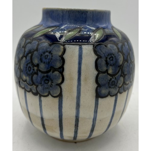 272 - Royal Doulton vase in blue floral design decorated by Annie Lyons. 16cm h.