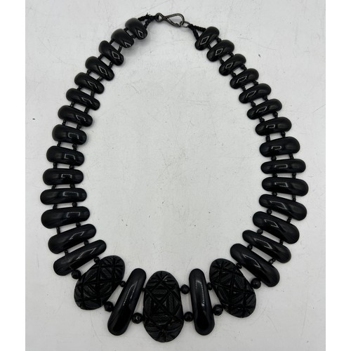 390 - A Victorian jet collar style necklace. Largest bead 4cm x 2.5cm.