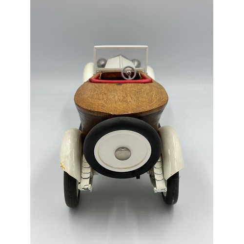 1288 - A scratch-built remote control model of a Rolls Royce with boat tail, fitted in a wood and glass cas... 