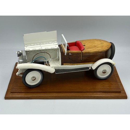 1288 - A scratch-built remote control model of a Rolls Royce with boat tail, fitted in a wood and glass cas... 