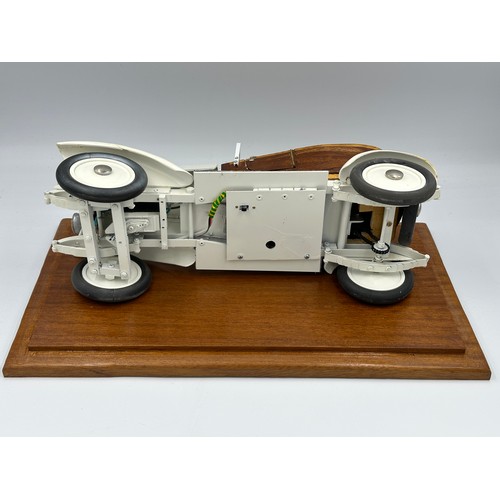 1288 - A scratch-built remote control model of a Rolls Royce with boat tail, fitted in a wood and glass cas... 