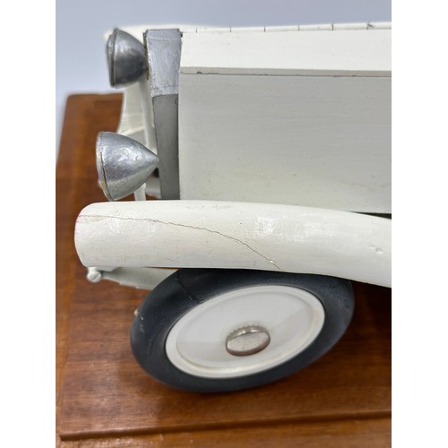 1288 - A scratch-built remote control model of a Rolls Royce with boat tail, fitted in a wood and glass cas... 