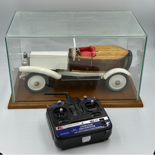 1288 - A scratch-built remote control model of a Rolls Royce with boat tail, fitted in a wood and glass cas... 