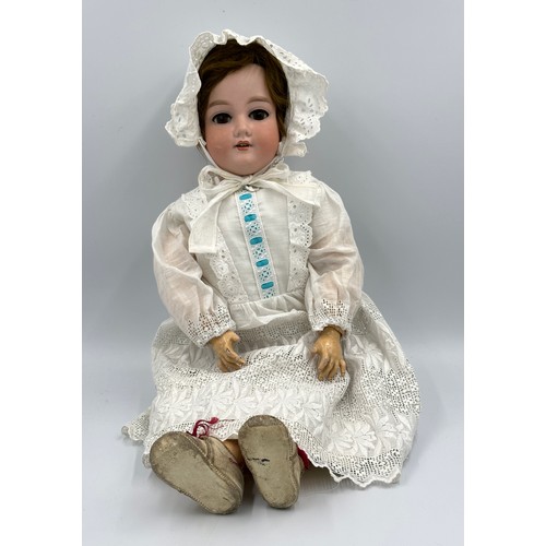 1073 - An Armand Marseille bisque headed doll marked 390 A.11.M. with weighted brown sleeping eyes, open mo... 